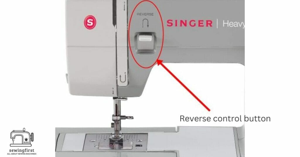 Back stitch reverse control button on a singer sewing machine