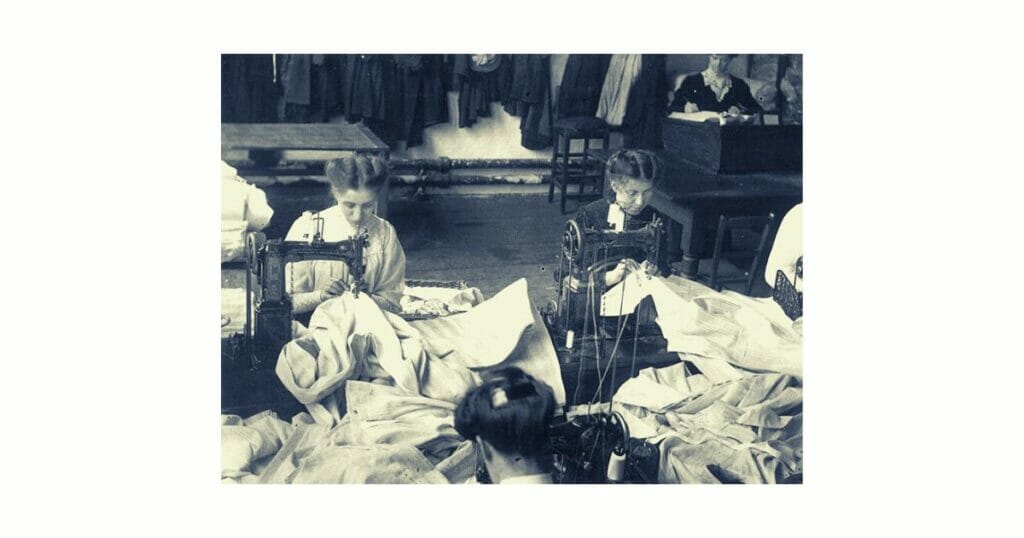 historical women working on sewing machine
